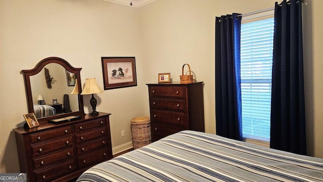 bedroom featuring baseboards