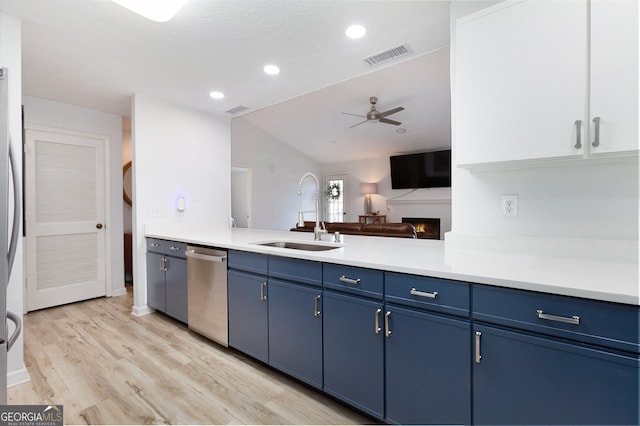 kitchen featuring blue cabinets, dishwasher, sink, ceiling fan, and light hardwood / wood-style floors