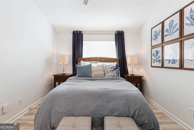 bedroom with light hardwood / wood-style floors