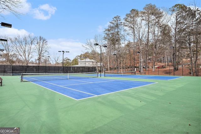 view of sport court featuring basketball hoop