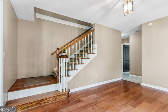 stairway with wood-type flooring