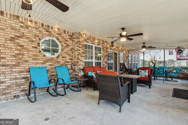 view of patio with ceiling fan and an outdoor living space