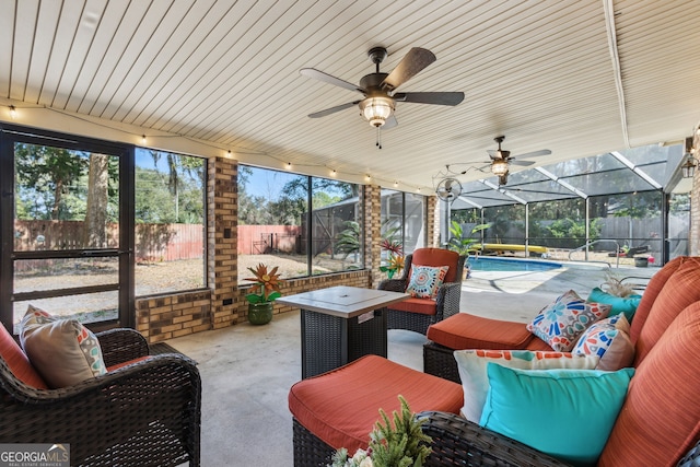 exterior space featuring a fenced in pool, an outdoor hangout area, and ceiling fan