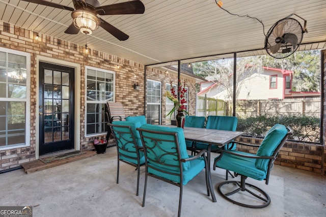 sunroom featuring ceiling fan