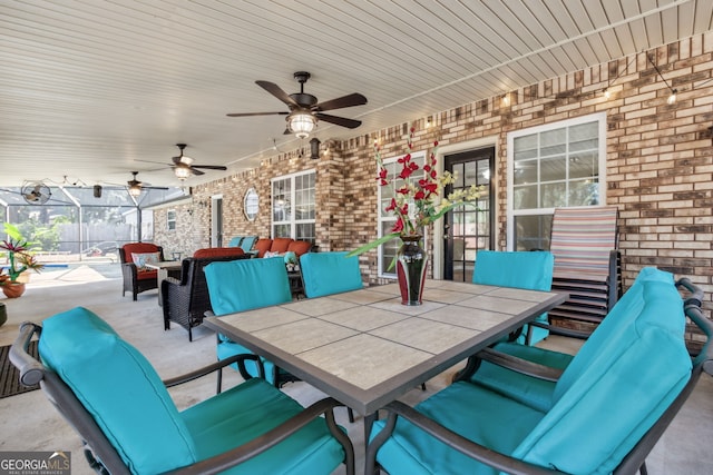 view of patio / terrace with ceiling fan and an outdoor living space