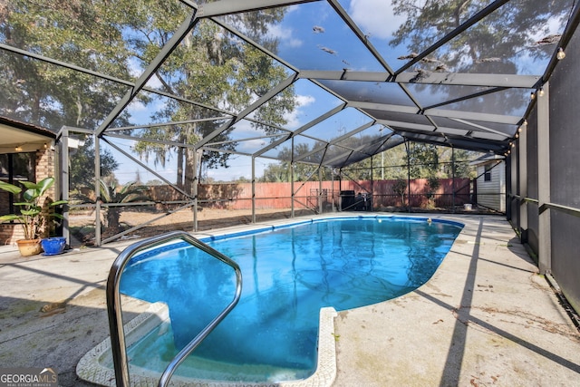 view of pool featuring a patio and a lanai