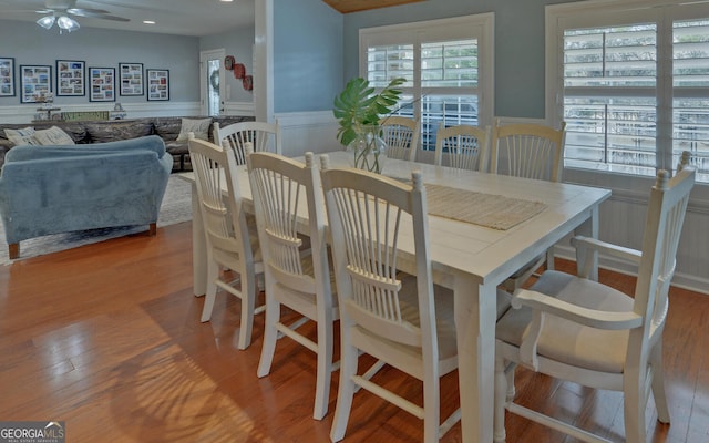 dining area with ceiling fan and light hardwood / wood-style flooring