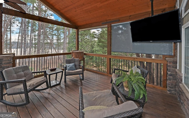 wooden terrace featuring an outdoor living space