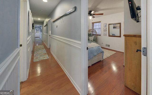 hall with wood-type flooring