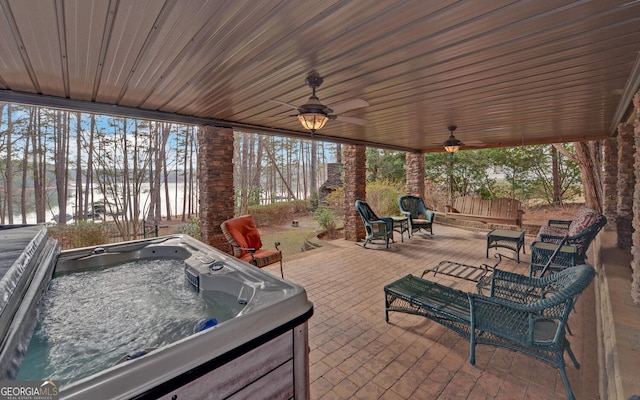 view of patio / terrace with a hot tub and ceiling fan