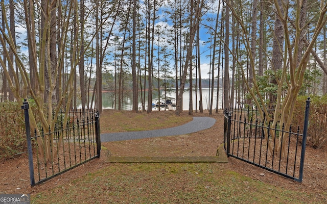 view of gate with a water view