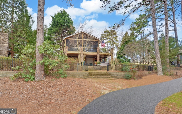 view of front property with a sunroom