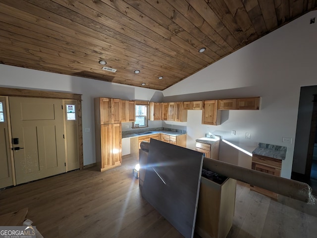 1117 Poor House Mountain Trl, Murphy, NC 28906 - kitchen with lofted ceiling, wooden ceiling, wood finished floors, a kitchen island, and recessed lighting