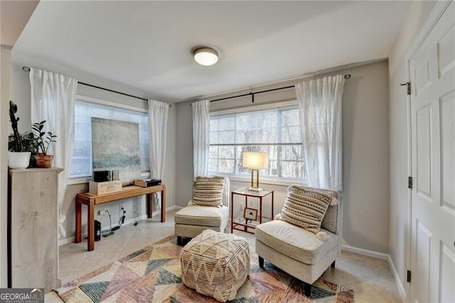 sitting room with light tile patterned floors