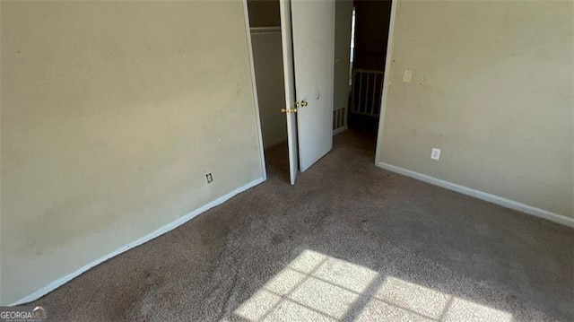 unfurnished bedroom with carpet