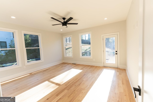 unfurnished room featuring ceiling fan and light hardwood / wood-style flooring