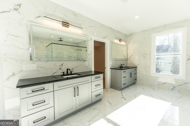 bathroom featuring vanity and a shower