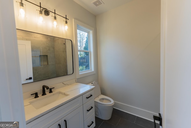 bathroom with tile patterned floors, toilet, and vanity