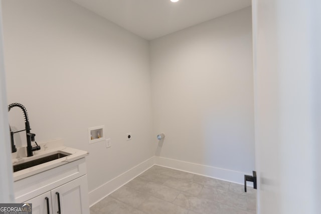 clothes washing area with cabinets, washer hookup, sink, and electric dryer hookup