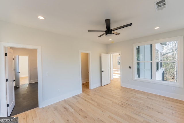 unfurnished bedroom featuring ceiling fan and light wood-type flooring