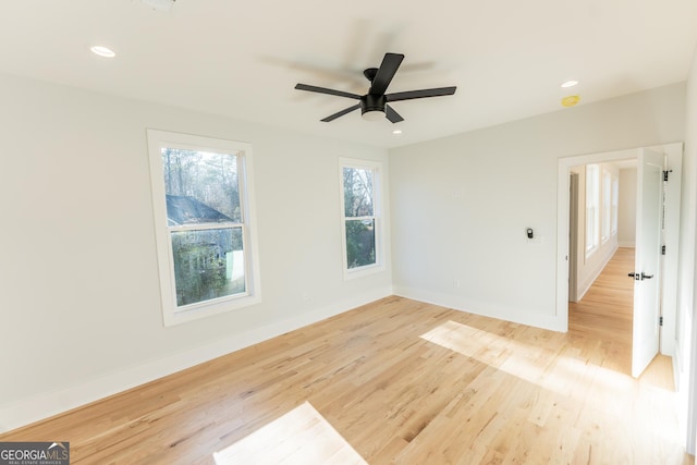 spare room with ceiling fan and light hardwood / wood-style floors