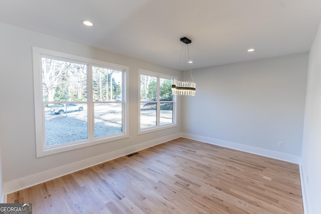 unfurnished dining area with light hardwood / wood-style floors