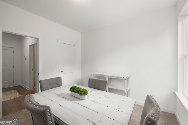 dining area featuring baseboards