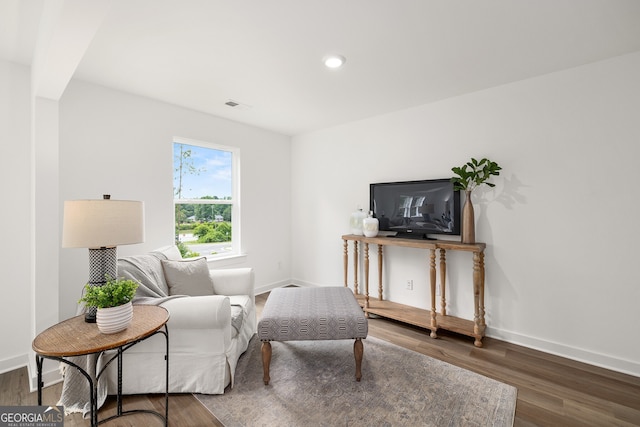 sitting room featuring recessed lighting, baseboards, and wood finished floors