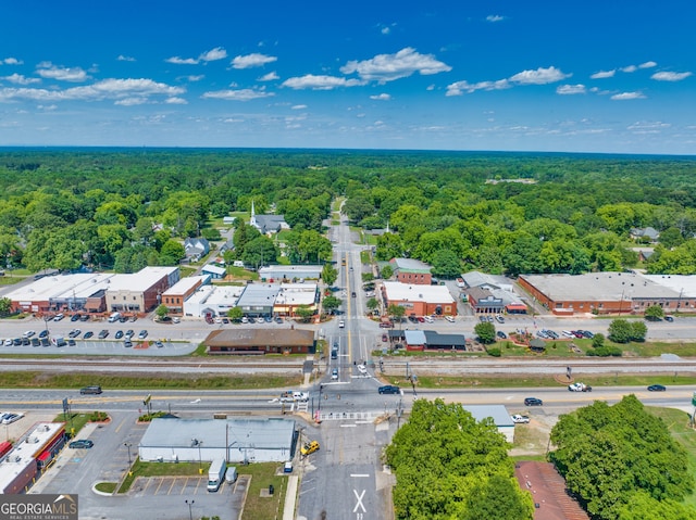 aerial view featuring a wooded view