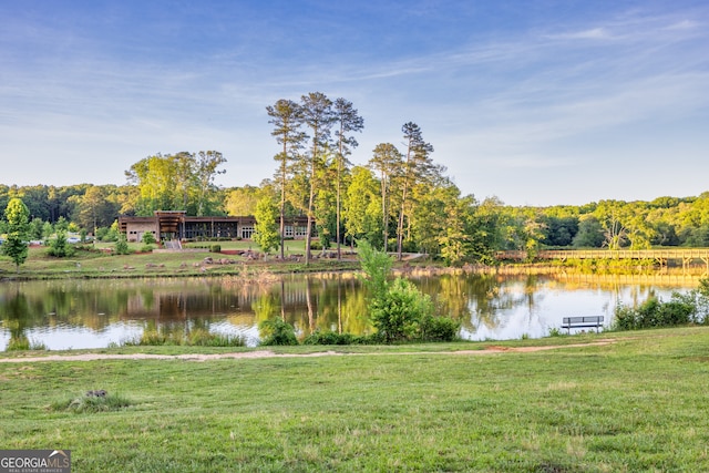 property view of water featuring a forest view