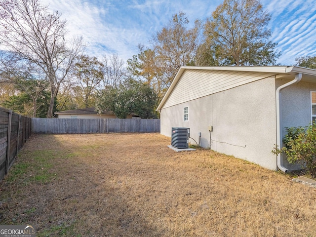 view of yard featuring central AC unit