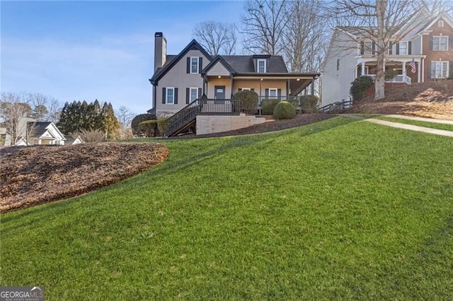 view of front of home with a porch and a front yard