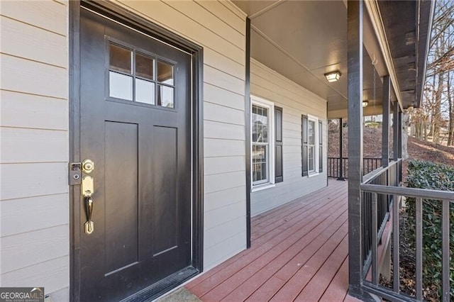 entrance to property featuring a porch