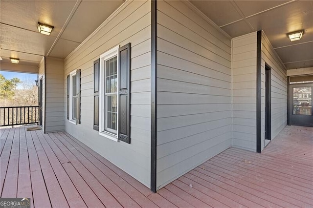 wooden deck featuring covered porch