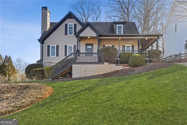 view of front of house featuring a porch and a front lawn