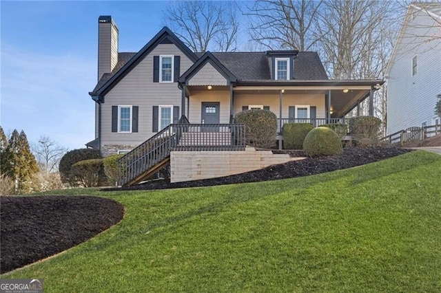 view of front of house with a porch and a front lawn