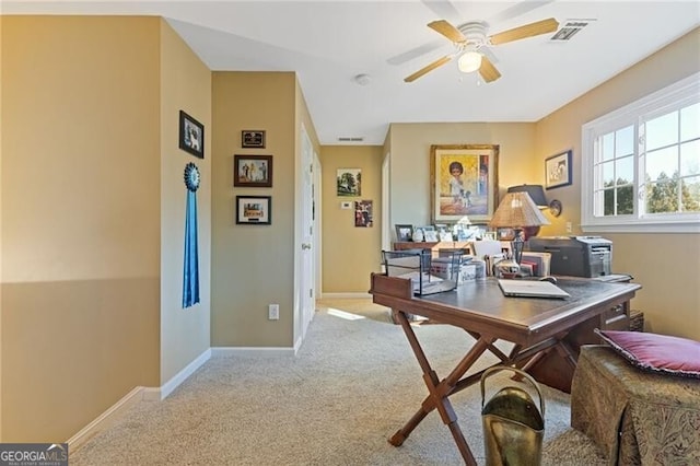 carpeted office with ceiling fan