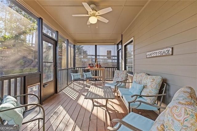 sunroom featuring ceiling fan