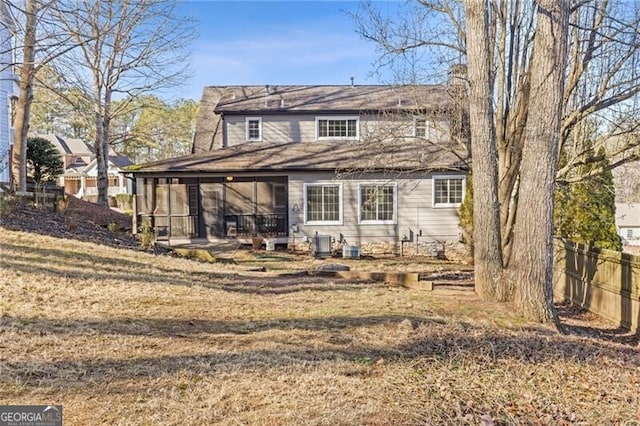 rear view of property with cooling unit, a lawn, and a patio area