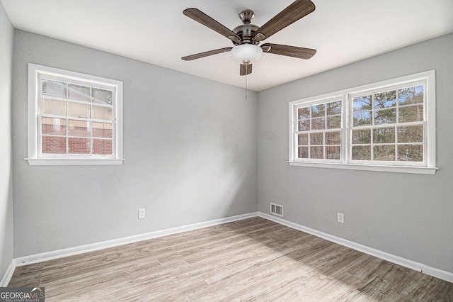 unfurnished room featuring ceiling fan and light hardwood / wood-style flooring