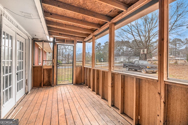 unfurnished sunroom with plenty of natural light