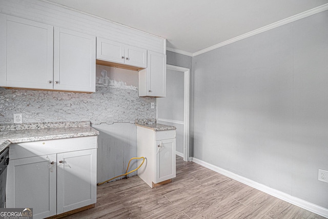 kitchen featuring white cabinets and light wood-type flooring