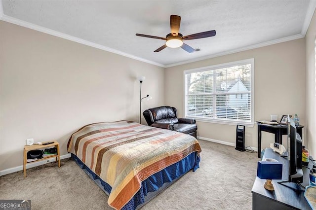 bedroom with crown molding, ceiling fan, and carpet