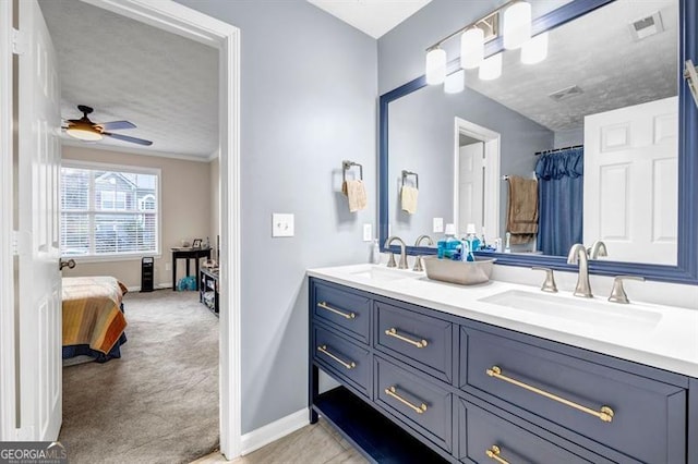 bathroom featuring vanity and ceiling fan