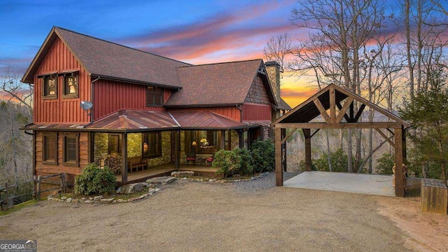 view of front of property featuring a gazebo and covered porch