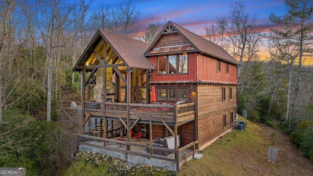 view of back house at dusk