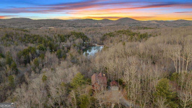 aerial view at dusk with a water and mountain view