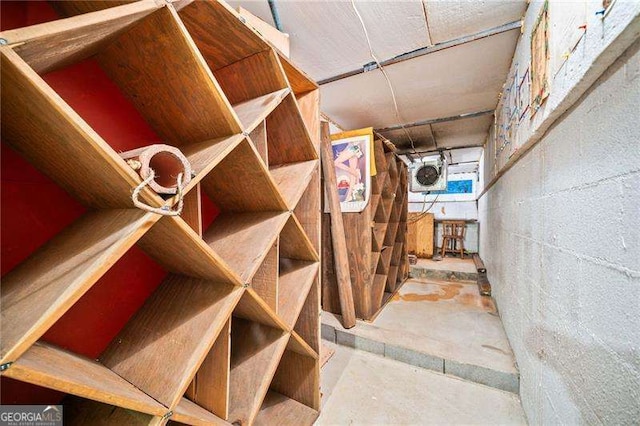 wine area featuring concrete flooring