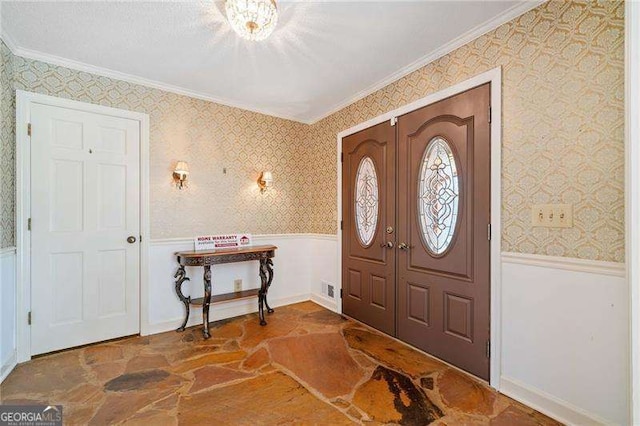 entrance foyer featuring crown molding