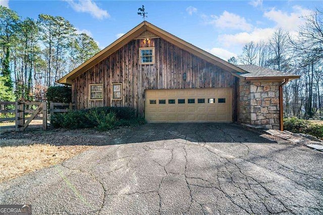 view of side of property with a garage